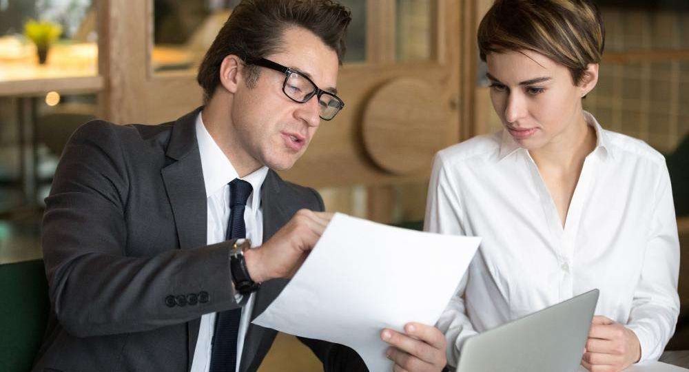 Attorney reviewing a document with a client